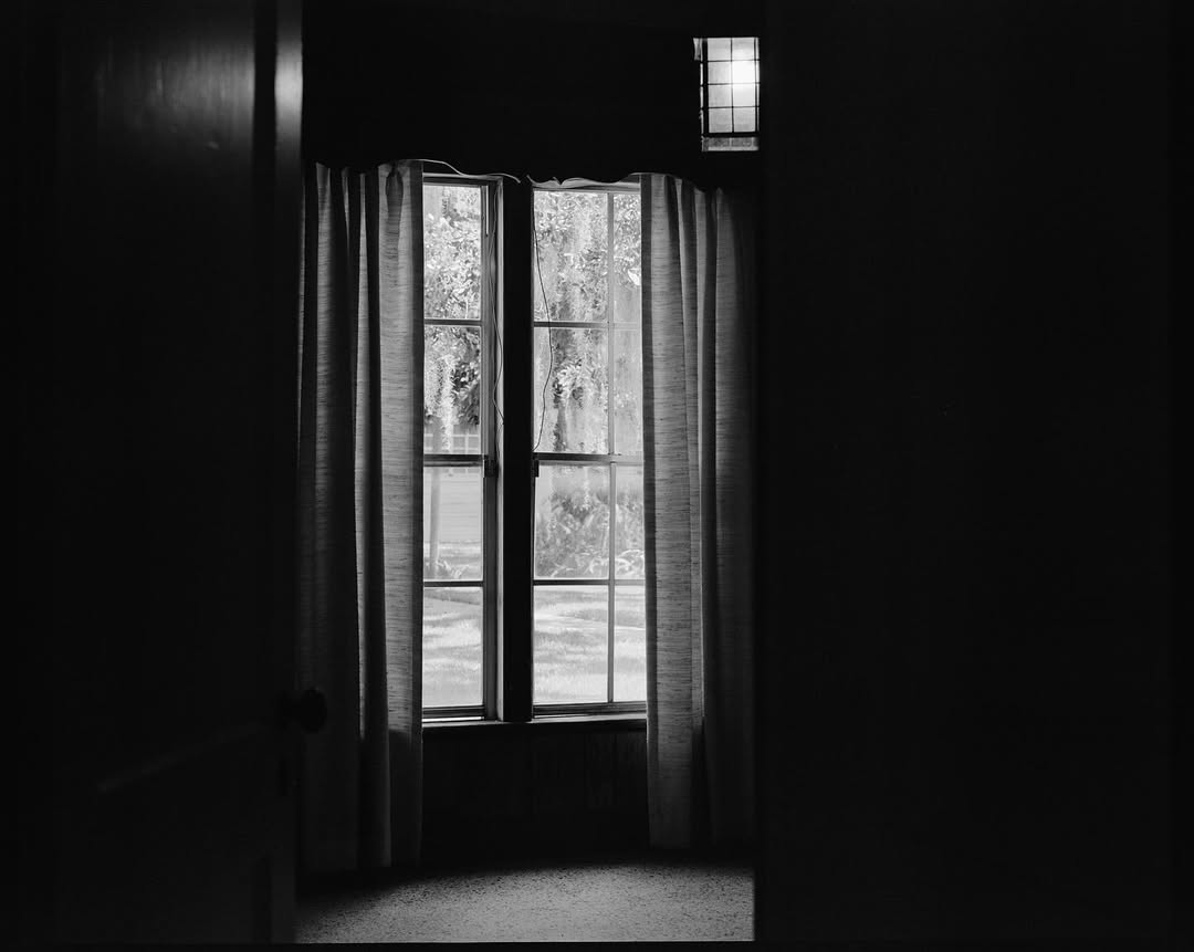 Interior window with curtains